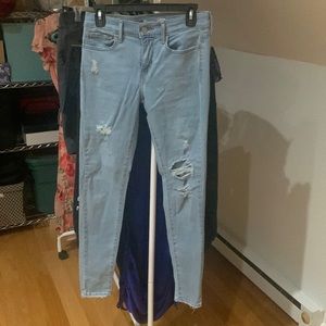Levi’s 710 super skinny jeans. Distressed and light wash. Size 27